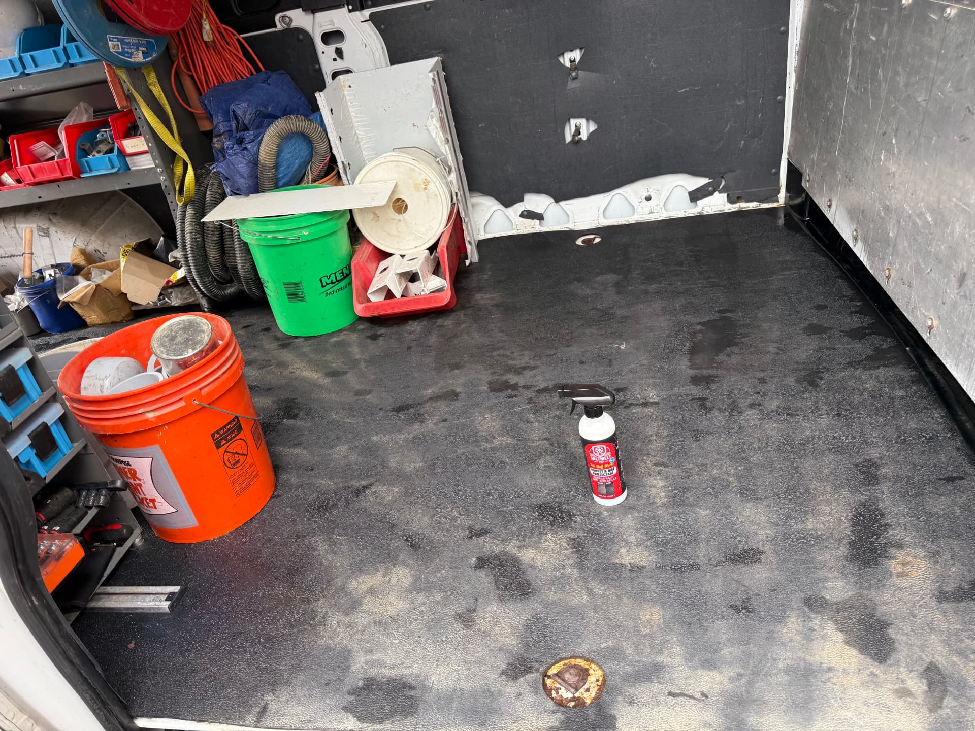 Work van vinyl floor with visible salt residue before treatment